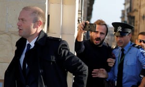 Malta’s prime minister Joseph Muscat arrives at his office before a meeting with members of the European parliament on 3 December.