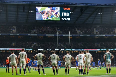 The England players wait as the TMO checks on the 5th France try.