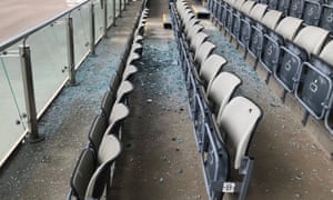 An area of level two seating is left covered in broken glass after a window fell from the floor above.