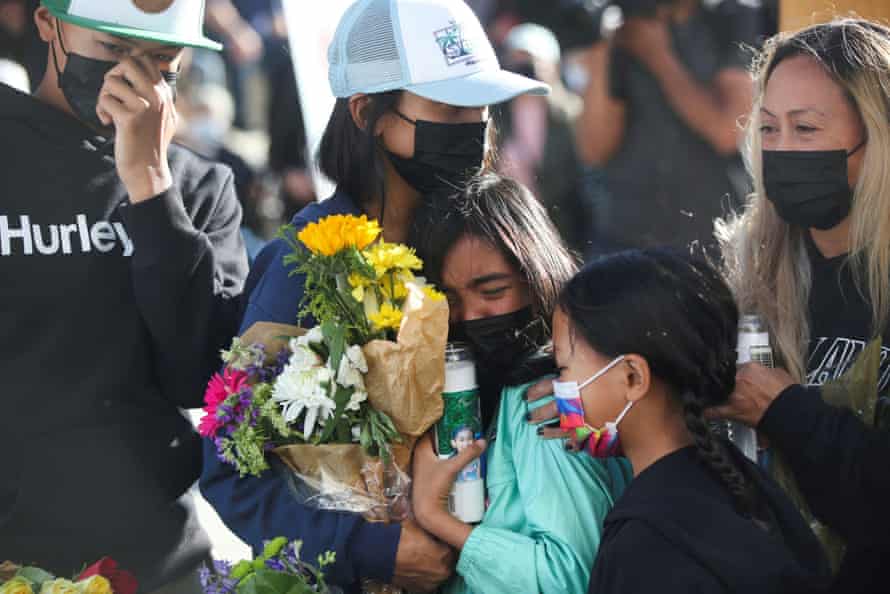 Paul Delacruz Megia's family members mourn during a vigil.