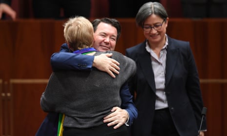 Australian Greens Senator Janet Rice (left) receives a hug from Liberal Senator Dean Smith after speaking on The Marriage Amendment (Definition and Religious Freedoms) Bill 2017 in the Senate at Parliament House in Canberra, Thursday, November 16, 2017. (AAP Image/Lukas Coch) NO ARCHIVING