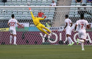 Yann Sommer tips over an effort by Kieffer Moore.