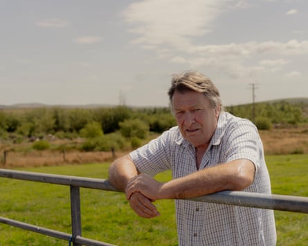 David Parker, a patient of Nick Hopper, leaning on a fence