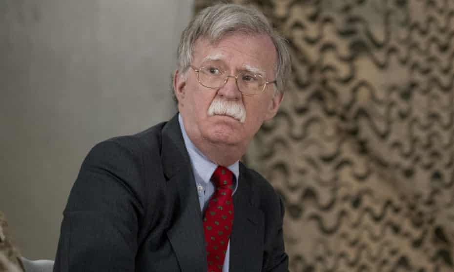 John Bolton attends a meeting with Donald Trump and senior military leaders at al-Asad airbase in Iraq on 26 December 2018. 