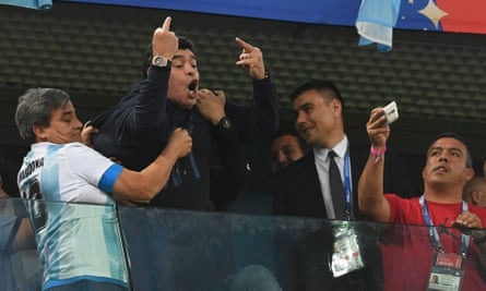Diego Maradona gestures to the crowd during the game against Nigeria, which Argentina won 2-1 to qualify for the knockout stage of the World Cup.