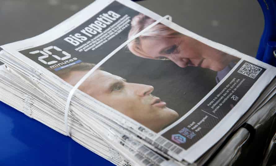 The front page of the French newspaper 20 Minutes at a newsstand in Paris