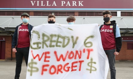 Aston Villa fans display a banner reacting to the collapse of the planned creation of a European Super League before their game with Manchester City on Wednesday.