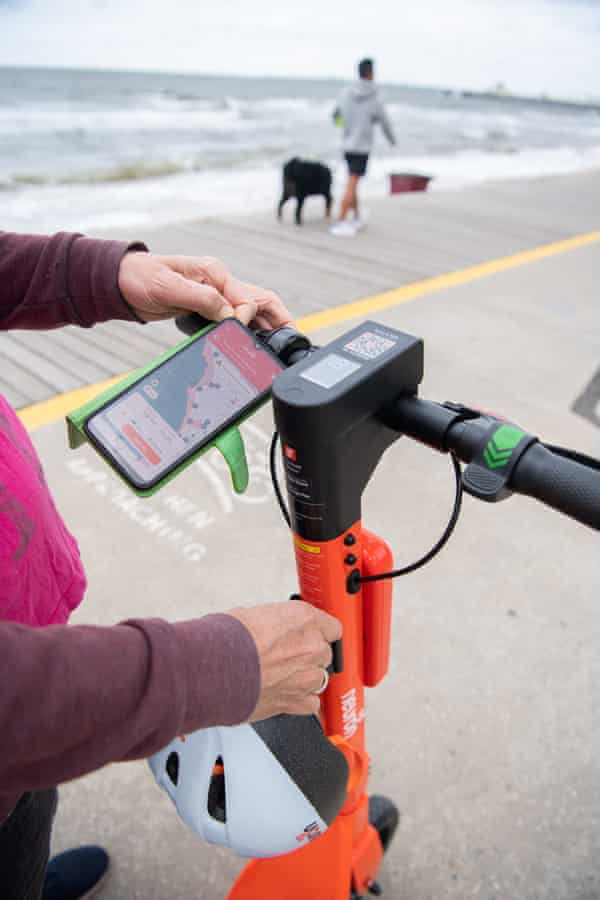 James Norman checks the map on his e-scooter app. 