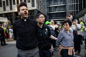 police escort a man and a woman