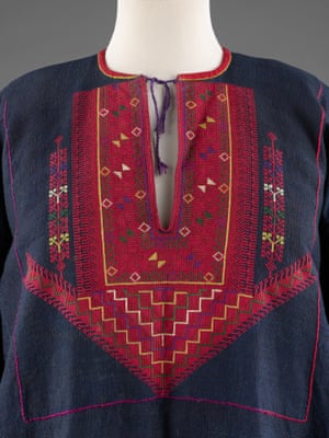 Chest panel of blue dress with red design