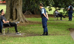 NSW police officers ask people to move on at Rushcutters Bay park in Sydney on Wednesday. Australia’s coronavirus lockdown rules come with hefty fines in some states – and seem to change daily. Can you walk your dog? Today, yes. Tomorrow, who knows? 