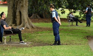 NSW police officers ask people to move on at Rushcutters Bay park in Sydney on Wednesday. Australia’s coronavirus lockdown rules come with hefty fines in some states – and seem to change daily. Can you walk your dog? Today, yes. Tomorrow, who knows?