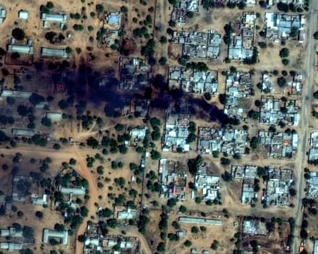 A satellite image shows smoke rising from fires near El Fasher airport