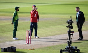 England captain Eoin Morgan performs the toss watched by Pakistan captain Babar Azam and filmed by the Sky robot.