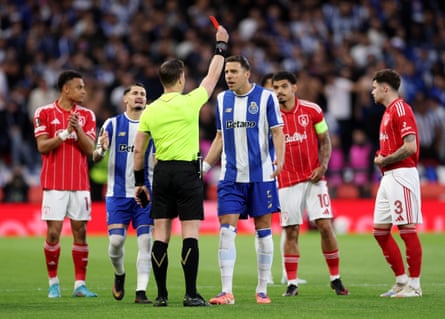 Jan Bednarek receives a red card from the referee, Danny Makkelie.