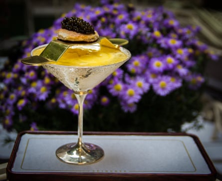 Colourful cocktail with flowers behind