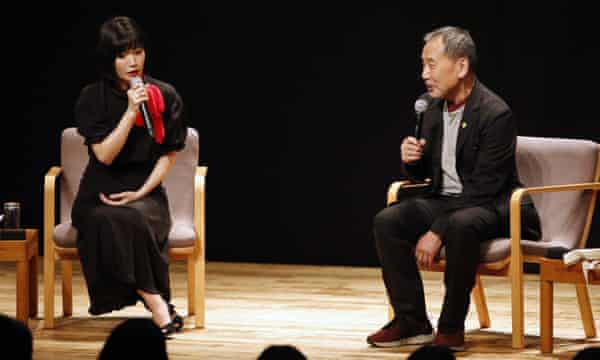 Praise … Kawakami speaks on stage with Haruki Murakami in Tokyo, in 2019.