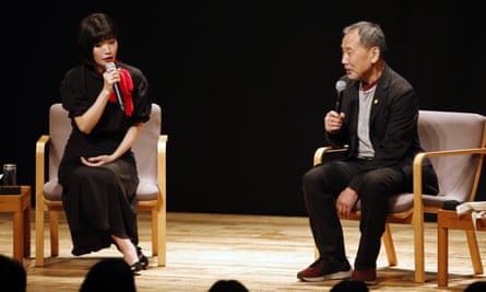 Praise … Kawakami speaks on stage with Haruki Murakami in Tokyo, in 2019.
