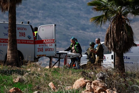 Israeli emergency workers move a casualty into an ambulance, at the scene of a shooting attack in Jordan Valley, in the Israeli-occupied West Bank February 4, 2025.