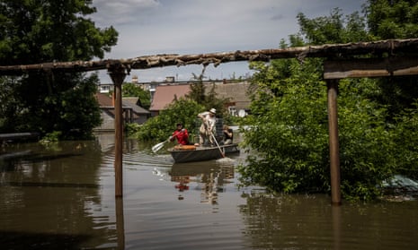 People and their pets were rescued by volunteers and emergency responders in small boats after the Kakhovka dam was destroyed in June.