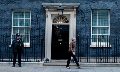 Theresa May walks away from 10 Downing Street.