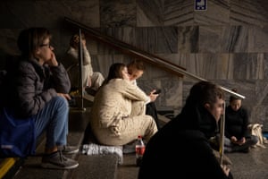 people sheltering in a metro station