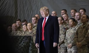 Donald Trump smiles before addressing members of the military during a surprise Thanksgiving Day visit at Bagram Air Field, Afghanistan, in 2019.