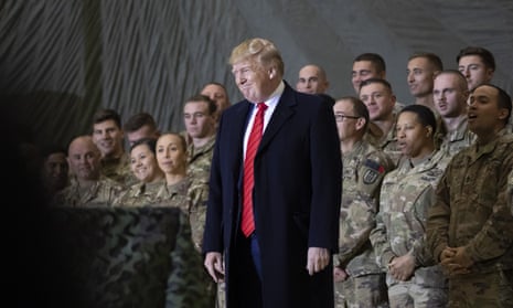 Donald Trump smiles before addressing members of the military during a surprise Thanksgiving Day visit at Bagram Air Field, Afghanistan, in 2019.
