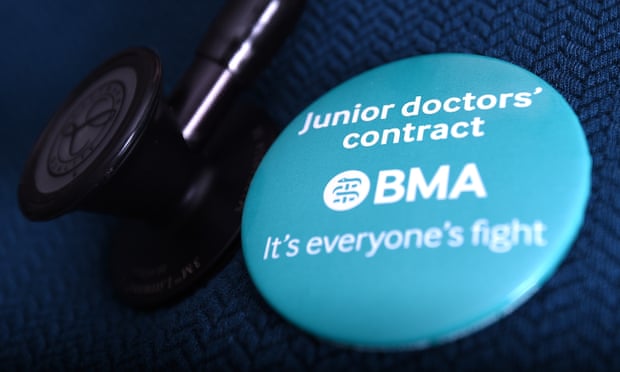 A doctor wearing a BMA campaign badge