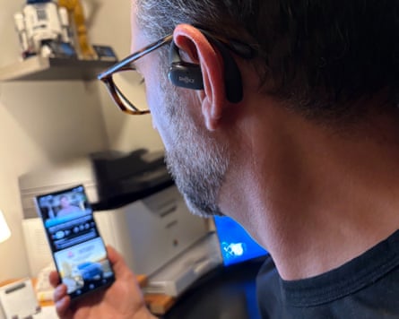 A pair of Shokz OpenFit 2 earbuds