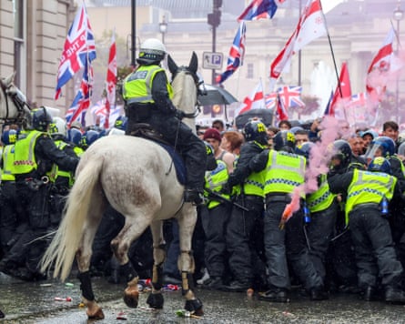 Police hold back protesters at the ‘unite the kingdom’ rally in London, 13 September 2025.
