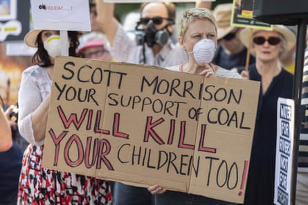 Protesters marched on prime minister Scott Morrison’s official residence in Sydney to demand curbs on greenhouse gas emissions and highlight his absence on an overseas holiday as bushfires burned across NSW.