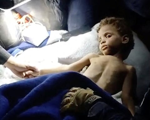 Klieber Moran after being freed from underneath rubble in Venezuela