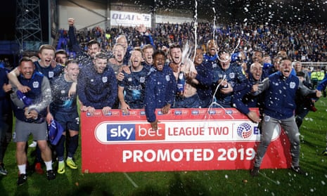 Bury celebrate this season’s promotion to League One, achieved against a backdrop of problems. 