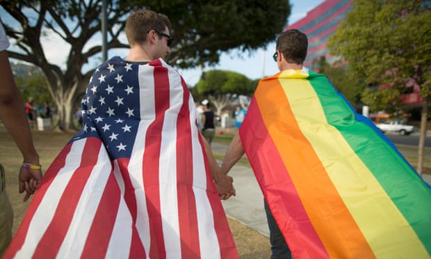 Male couple with US and rainbow flags