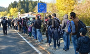 German police guide refugees after they crossed the border from Austria.