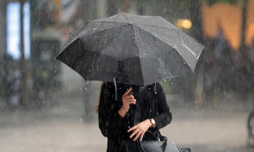Woman With Umbrella In Heavy Rain