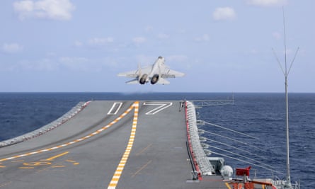 A J-15 Chinese fighter jet takes off from an aircraft carrier