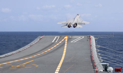 Fighter jet takes off from aircraft carrier