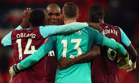 Angelo Ogbonna of West Ham United celebrates with his team mates after the Carabao Cup Fourth Round match.