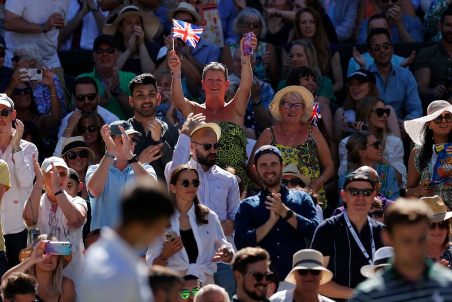 The Centre Court crowd cheer Cameron Norrie after he took the opening set against Novak Djokovic in the men’s singles semi-final.