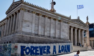 Graffiti referring to Greek debt outside the Academy of Athens