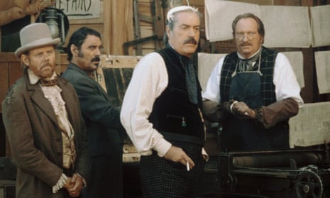 Powers Boothe, second right, standing next to Ian McShane, second left, in Deadwood, 2004.