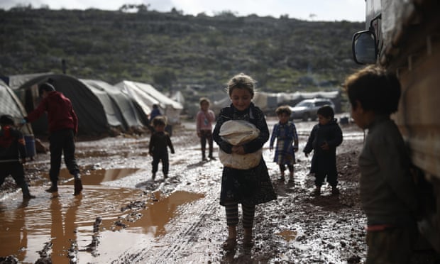 Refugees in a camp in Idlib, Syria, some of the 24 million people in the country now relying on aid to survive.
