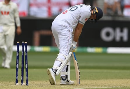 Joe Root looks back at his stumps after being bowled off an edge by Mitchell Starc