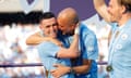 Phil Foden and Pep Guardiola embrace during the title winning celebrations. Manchester City v West Ham at Etihad Stadium. Premier League. 19 May 2024. By Tom Jenkins for The Guardian.