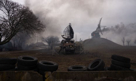 Smoke rises from an air defence base in the aftermath of a Russian strike in Mariupol, 24 February