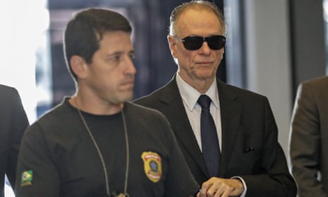 Carlos Arthur Nuzman, right, the president of the Brazilian Olympic Committee and honorary member of the IOC, arrives at the headquarters of the Federal Police to give a statement in Rio.