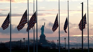 American flags are seen flying at half-staff at Liberty state park in Jersey City, New Jersey, to mark the death of Carter
