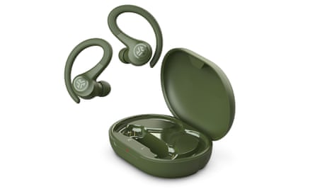 A pair of dark green earbuds next to their open case